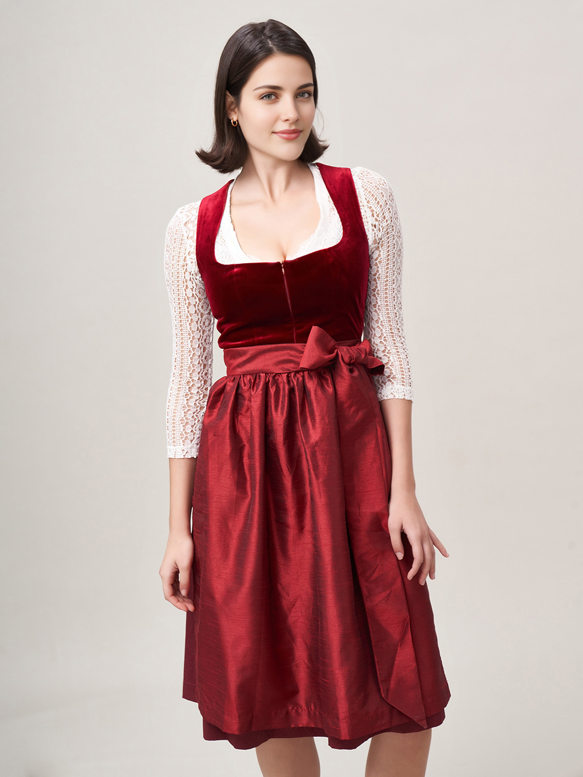 Ein elegantes rotes Dirndl mit schwarzer Schürze, perfekt für festliche Anlässe.